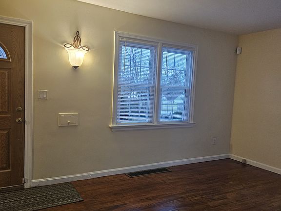 Living room with partial view of entrance.