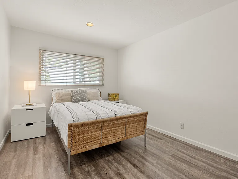 Bedroom with window into backyard