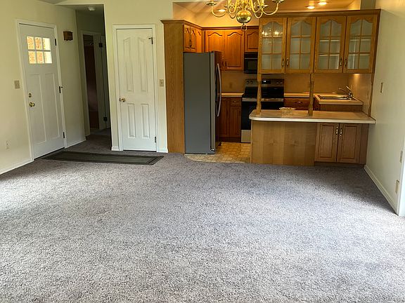 Living room to kitchen closet hallway and front door