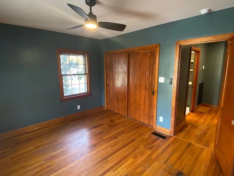 Bedroom 1 in front of the home with largest closet.