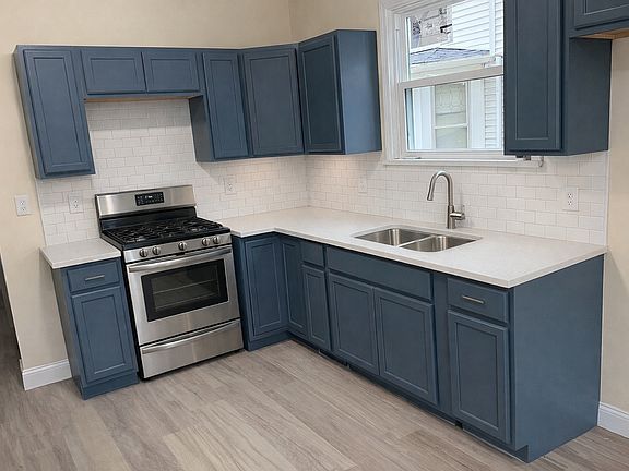 Newly remodeled kitchen with quartz countertops. Fridge provided as well.