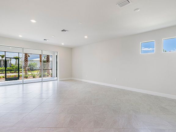 Another view of the gathering room with access to the covered lanai through the sliding glass doors