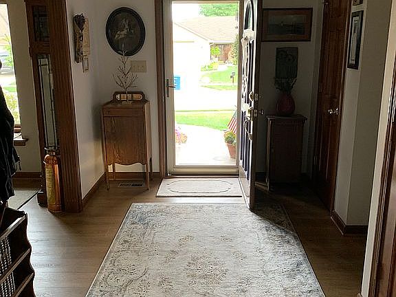 foyer with tray ceiling