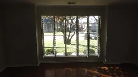 Formal dining w/ shuttered bay window