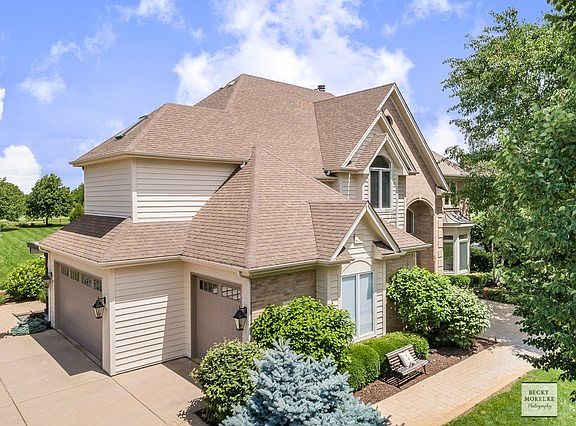 Brick & cedar front w/lovely paver front couryard & walkway!