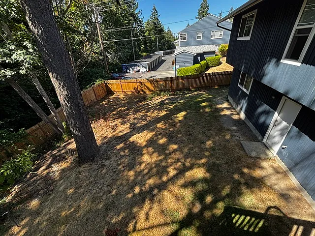 Fully fenced back yard along with green belt