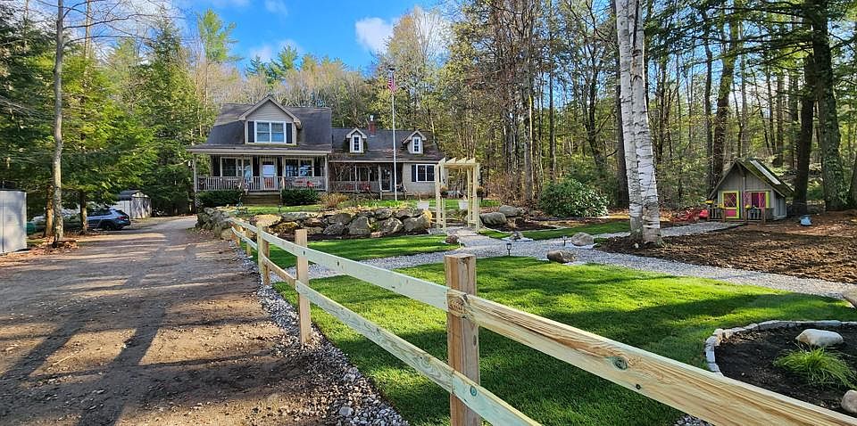 The front of the house includes a beautiful garden area.
