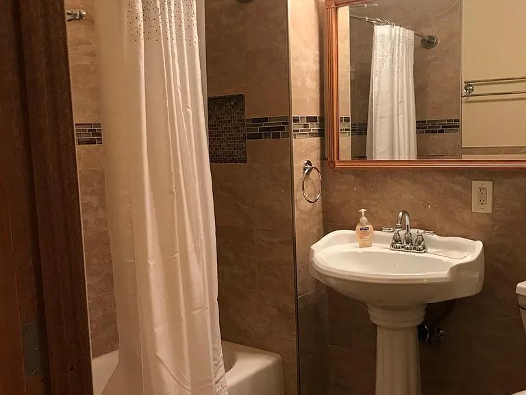 inside bathroom showing bathtub area