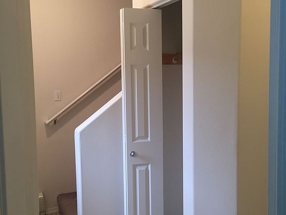 Entryway coat closet with high ceilings & direct access from
