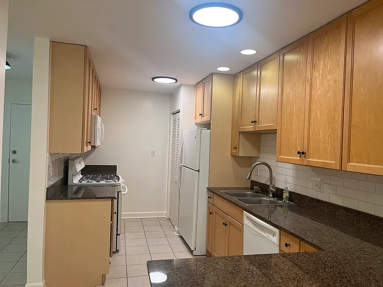 Kitchen with gas stove, granite countertops and plenty of storage