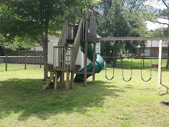 Swing set and storage facility