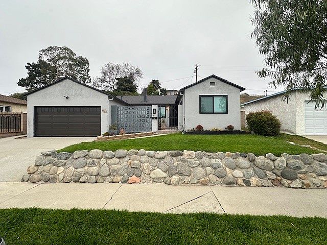 Front of Home with a Private Courtyard.