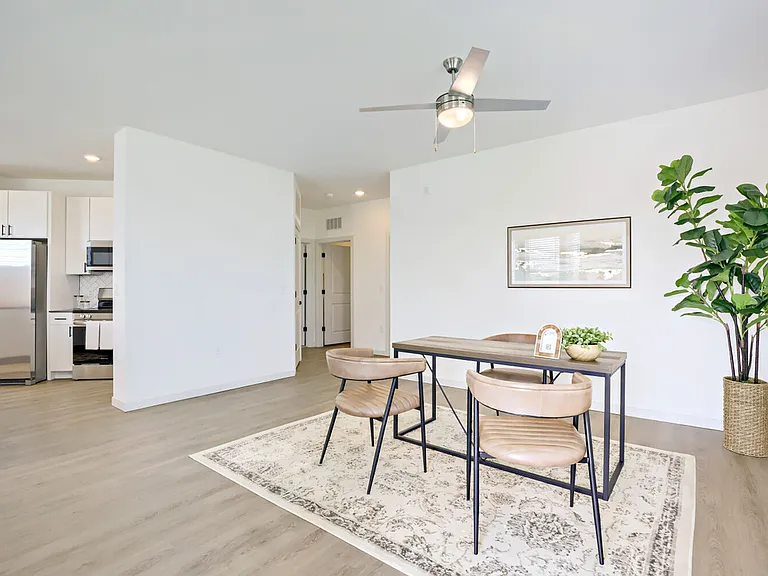Distinct living and dining areas give you space to gather, share meals, and make memories. Garrett Harvest Junction West, Longmont, CO.