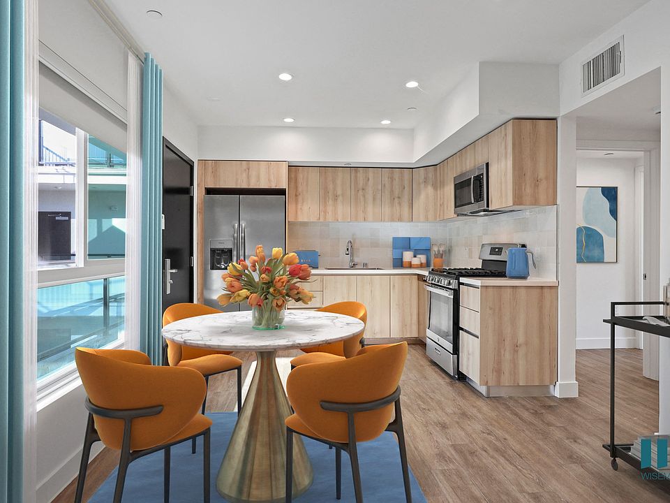 Open-Concept Kitchen and Dining Space with Large-Size Windows