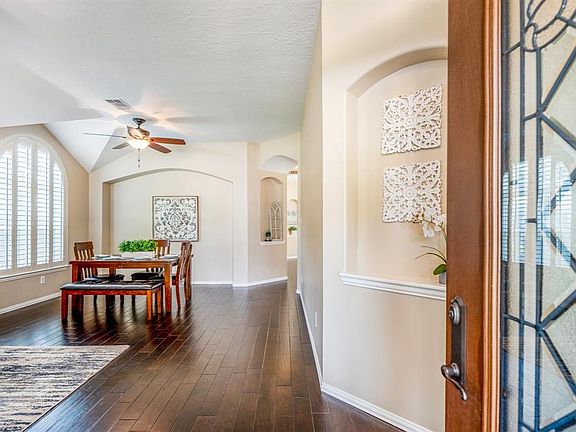 Come on in! Upon entering the home you are greeted by the gorgeous dark hardwood flooring that flows through the main areas of the home. To the left, w/ an open concept, are the den & formal dining area & to the right is the study.
