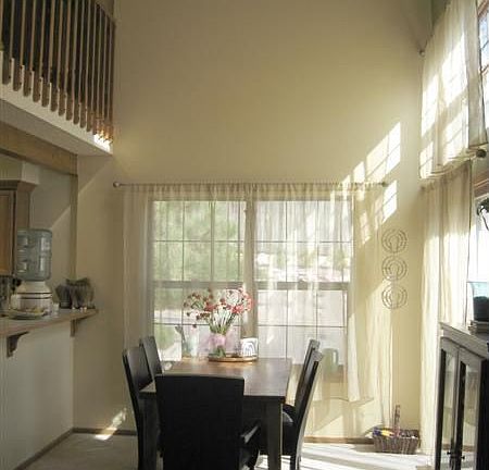 dining room: vaulted ceilings with skylight and high end ceiling fan