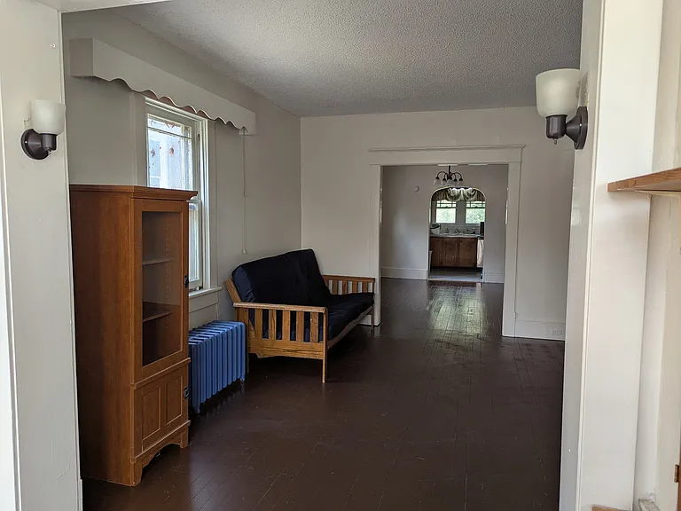 Available furnishings include full-size fouton sofa and curio cabinet.