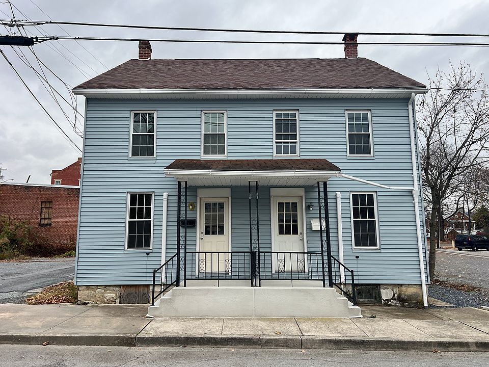 The apartment is on the left side of duplex with 2 parking spaces in the back of the house.