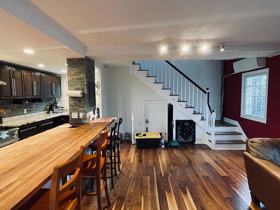 Pecan hardwood flooring; natural light from west and north.
