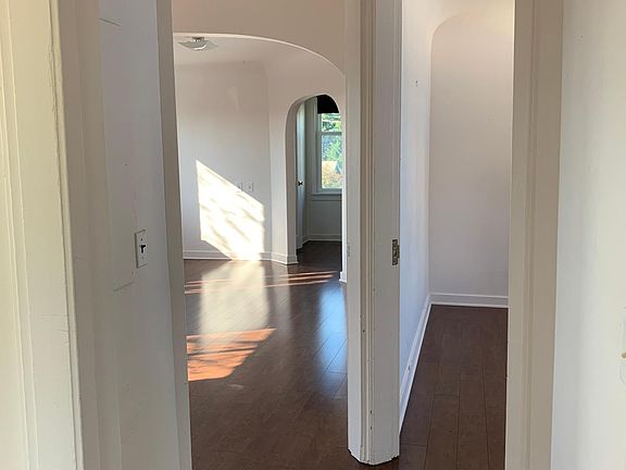 View from the stairs, looking at the living room and bedroom.