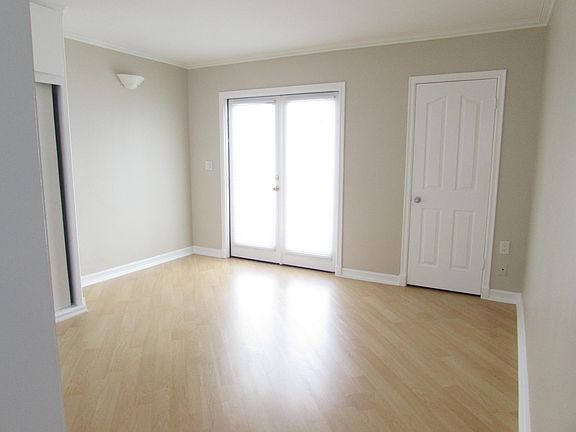 Looking from kitchen areat to entry and closet to left of entry