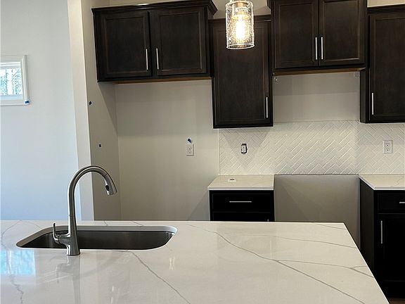 This kitchen showcases a clean and inviting aesthe
