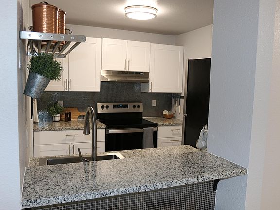 Beautiful granite counters with stainless steel appliances and accents!