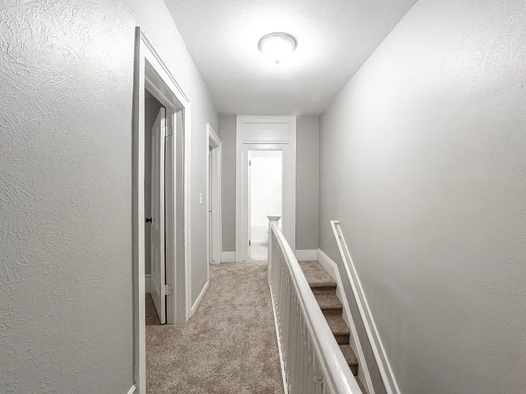 Hallways with linen closet and bedrooms