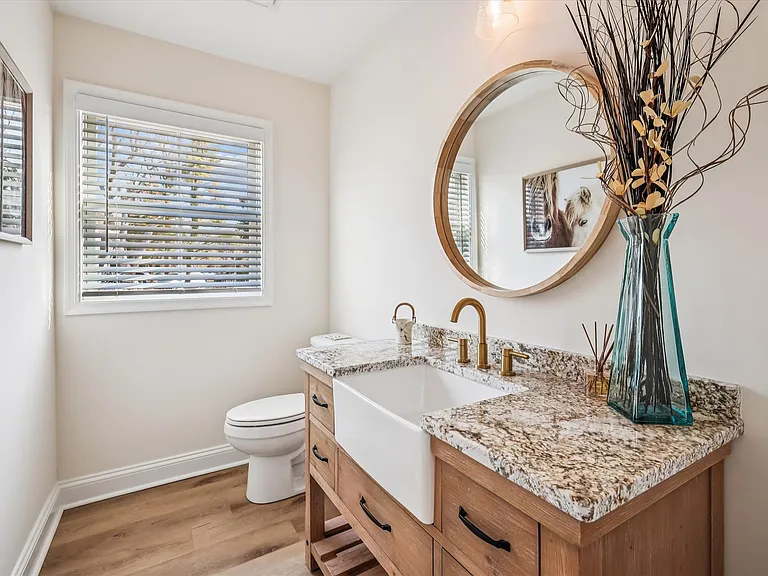 Custom Vanity with Granite Countertops in Powder Bathroom