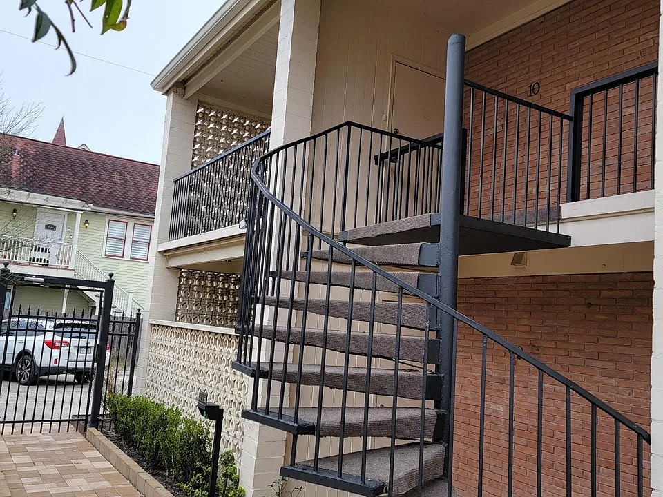 Spiral staircase leading up to the apartment.