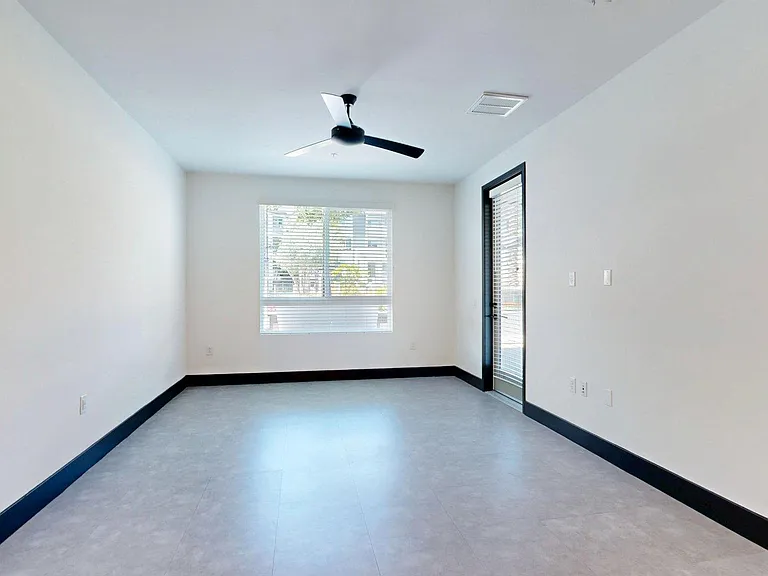 Apartment living room with tile floor.