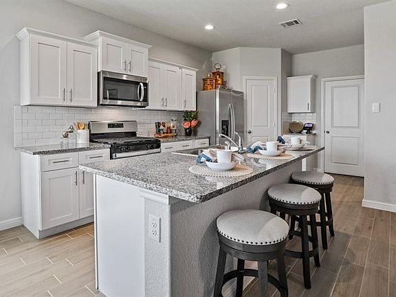 Kitchen - All Home and community information, including pricing, included features, terms, availability and amenities, are subject to change at any time without notice or obligation. All Drawings, pictures, photographs, video, square footages, floor plans, elevations, features, colors and sizes are approximate for illustration purposes only and will vary from the homes as built.