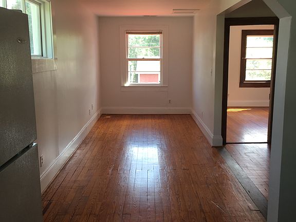 View as you stand in the kitchen and look through then angled passthrough into the living space.