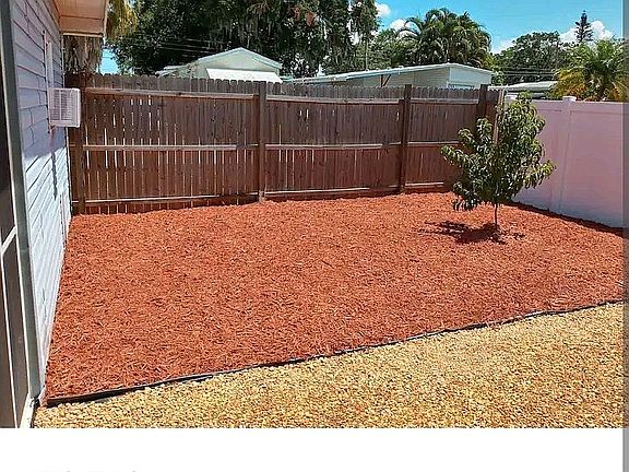Fenced Yard w/Peach Tree