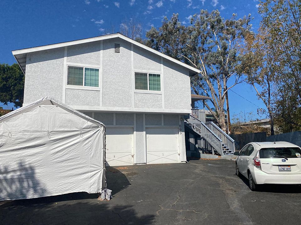 Triplex building tucked up on a cul-de-sac surrounded with some trees on your right and some trees on the backside of the building. Long driveway with plenty of off street parking for safety. Motion detector light for night time vision and safety.