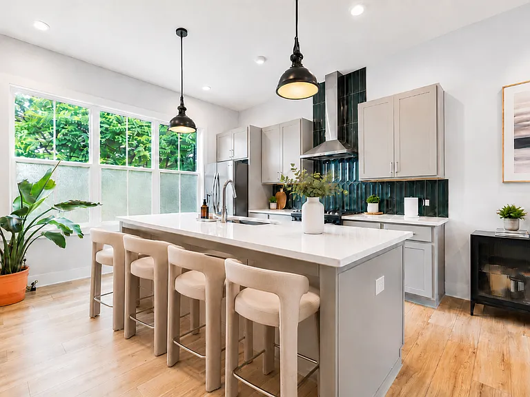 Kitchen with updated backsplash, Saumsung connected fridge with screen and large windows