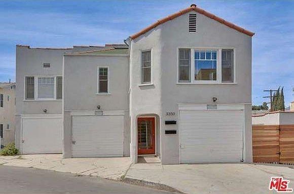 Street view including garage and driveway