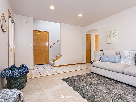Front entry. Garage door straight ahead. Stairs up to 2 bedrooms & a full bathroom.