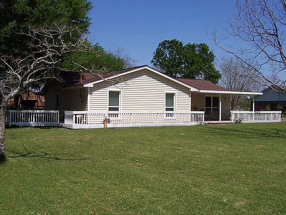 Large front yard and wrap around deck