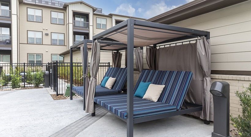 Resort-Style Pool with Tanning Ledges, Cabanas & Hot Tub at The Bridge at McKinney