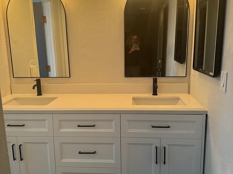Newly updated primary bath with dual sink vanity and lots of storage.