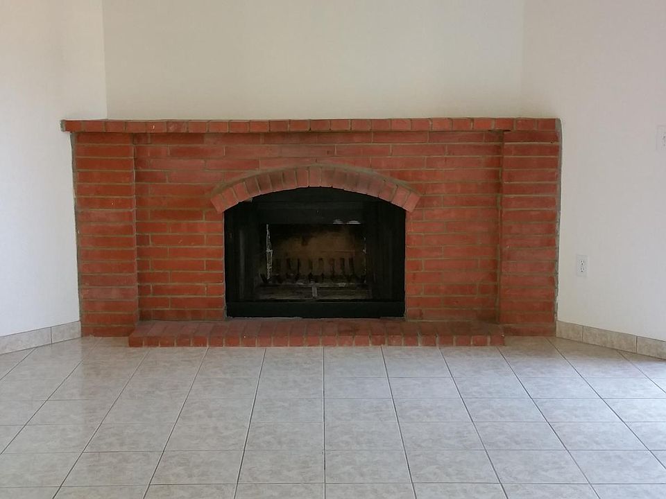 Fireplace with tile flooring