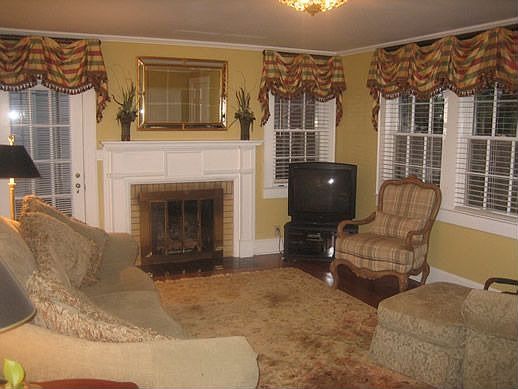 Large living room with hardwoods and fireplace