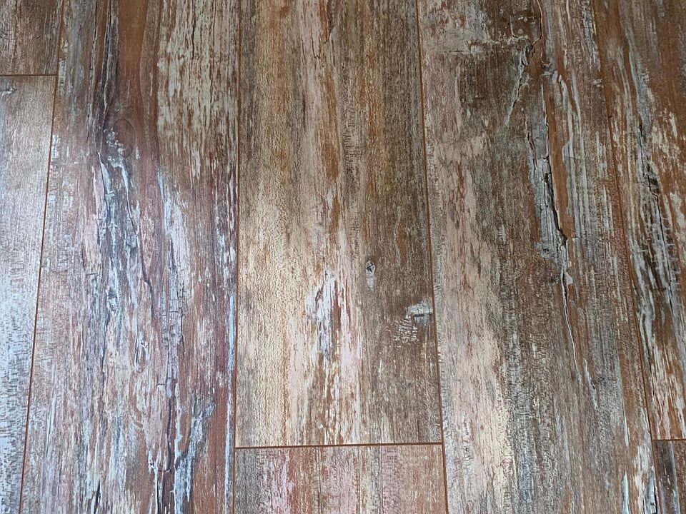 LL Flooring, Aquaseal Water Resistant being installed along with new trim