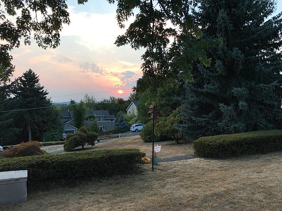 sunset from living room, dining room two bedrooms and the de