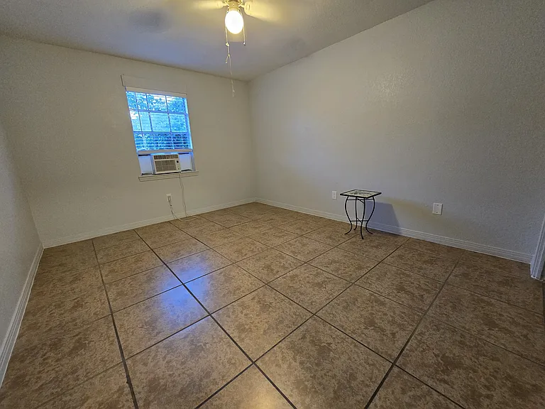 Large front bedroom with window and air.