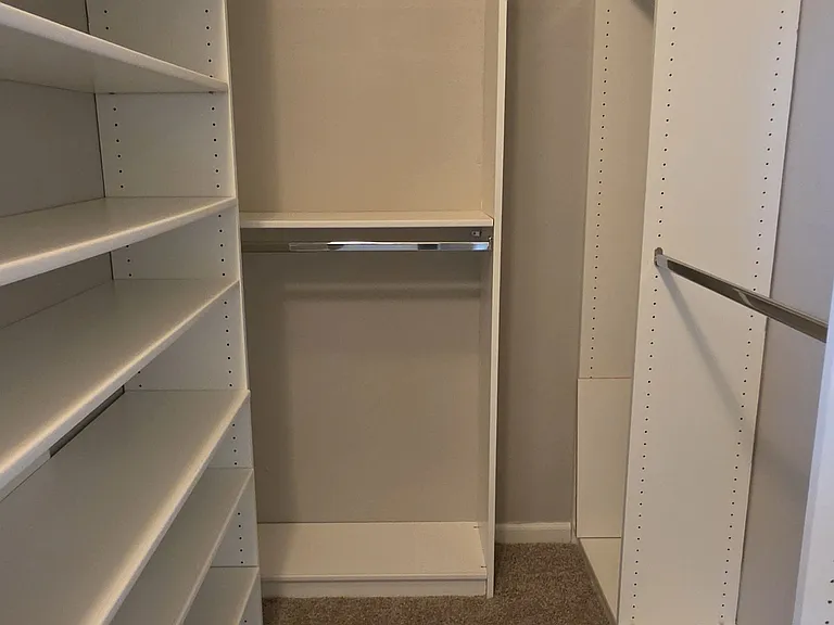 Master closet offers built-in storage to help you organize your space