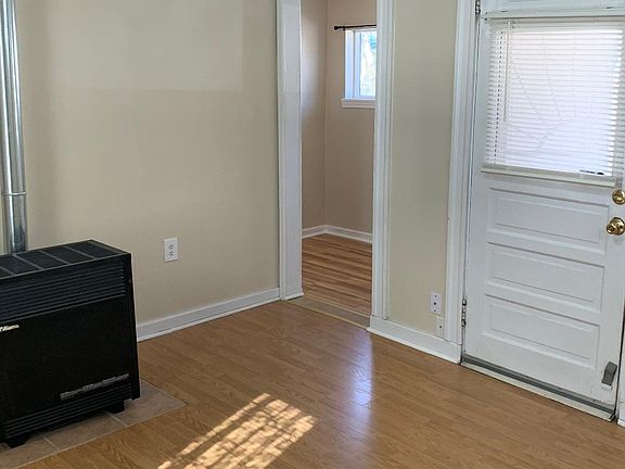 Living room looking into bedroom area