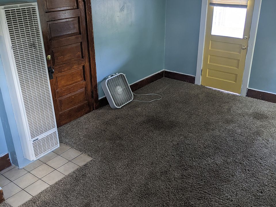 Living room with front and back door view