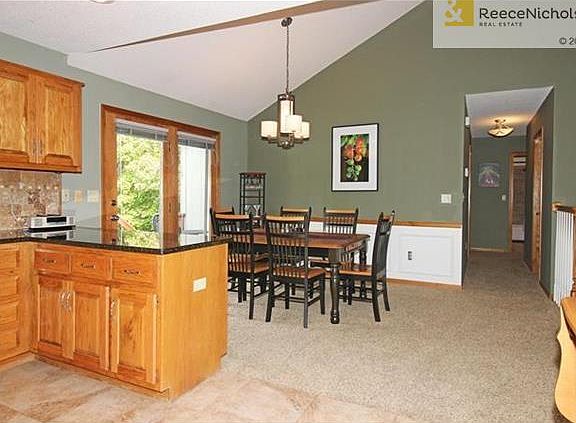 Kitchen Opens to Dining Room with another Updated Light Fixture